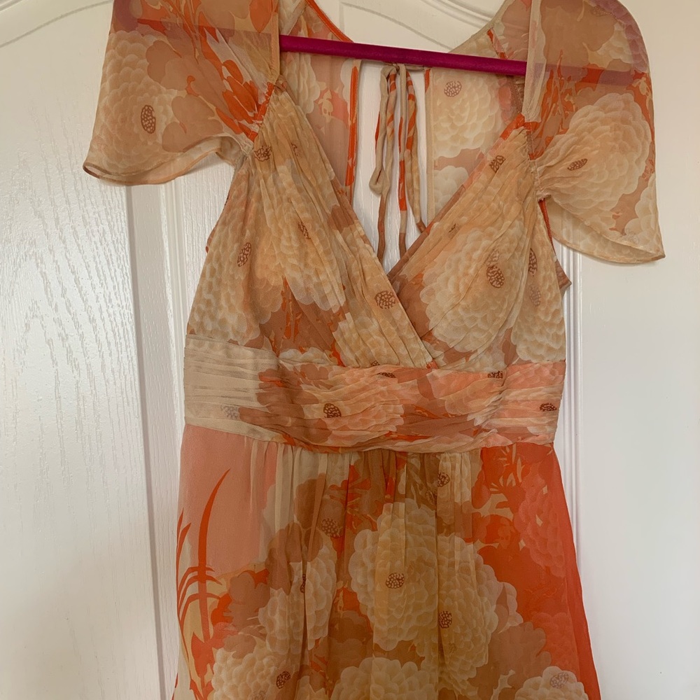 Delicate and soft coral blouse with shell/pearl like button down back